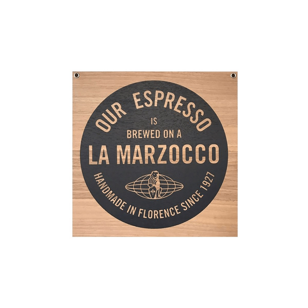 La Marzocco wooden sign "Our espresso is brewed on a La Marzocco" – Coffee Coaching Club 1